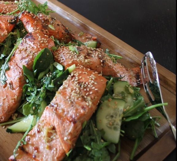 Bigelow Tea Tea Marinated Cedar Salmon over Sesame-Honey Greens