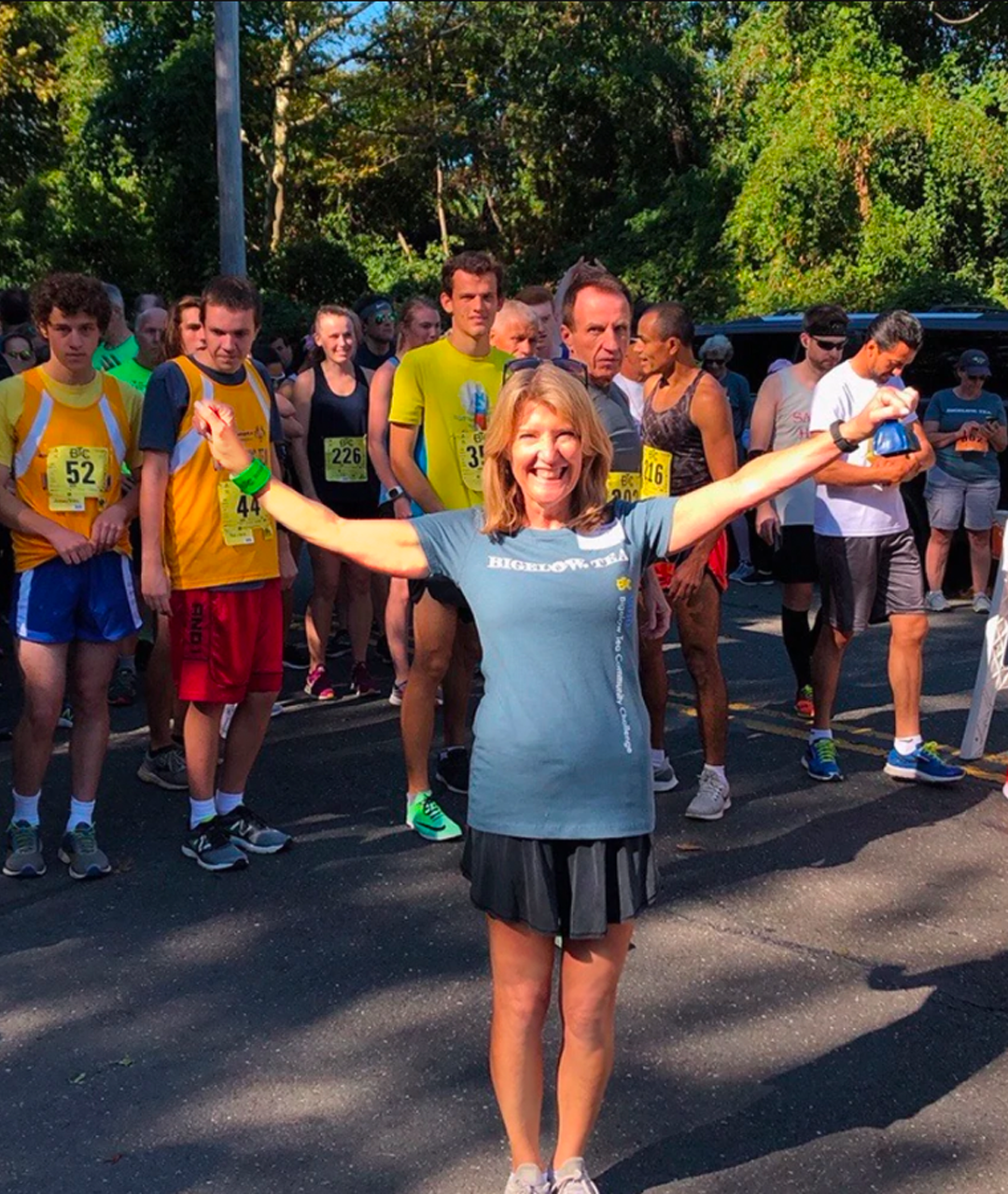 Bigelow Tea | Giving Back - image of Cindi Bigelow infront of runners - Mobile