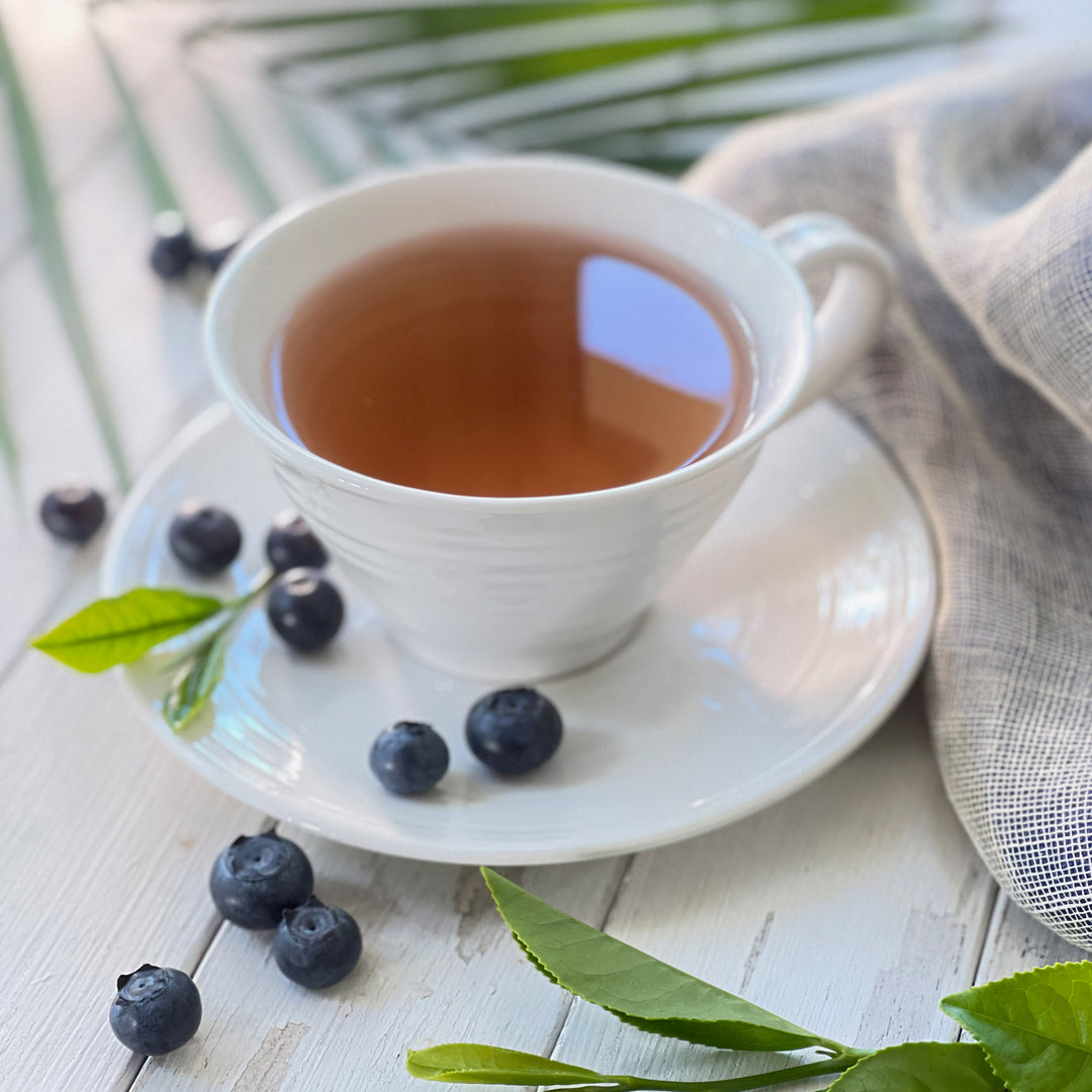 Cup of Green Tea with Blueberry and Acai